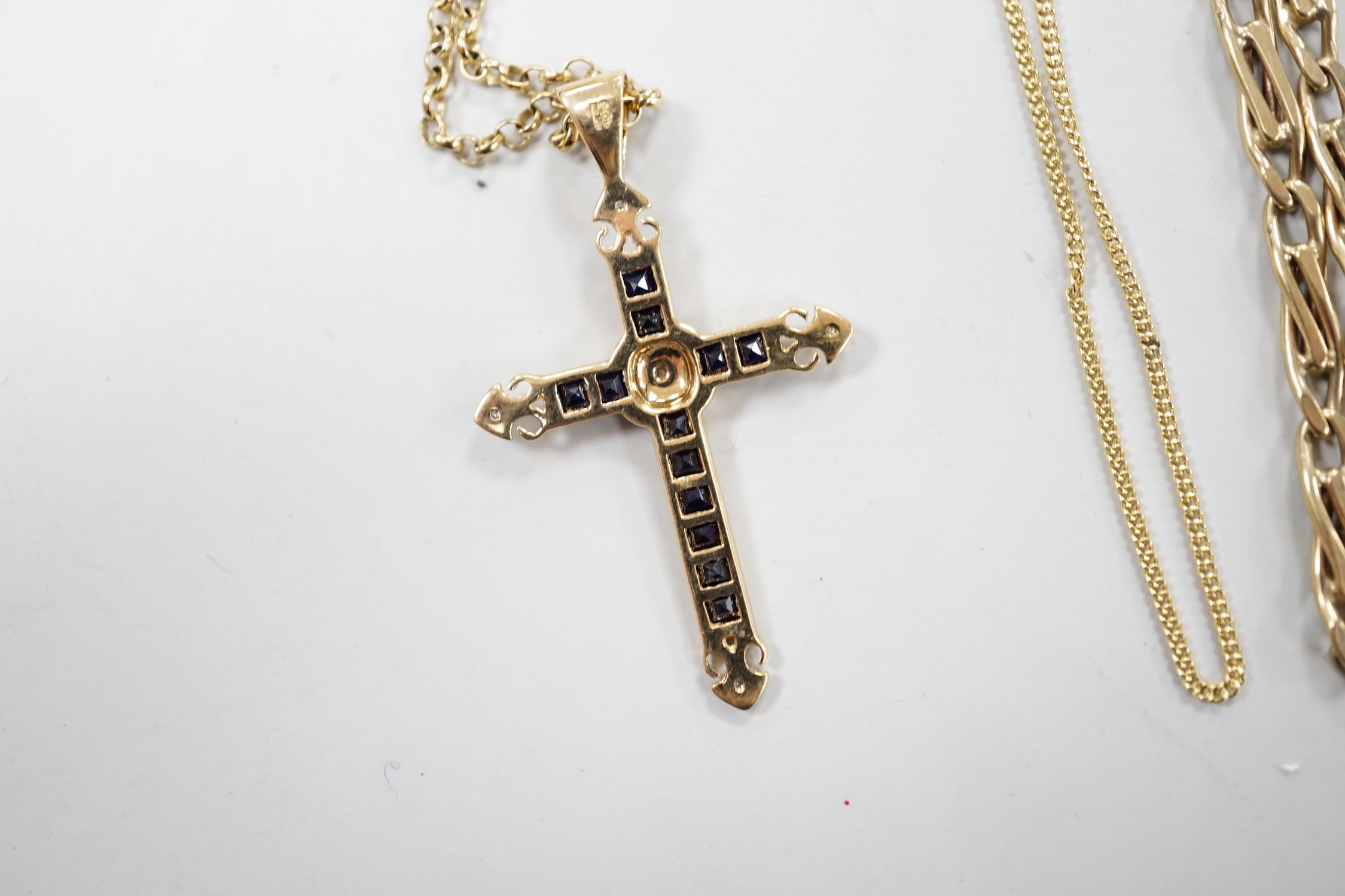 A modern 9ct gold, sapphire and diamond cluster set cross pendant, 33mm, on a 9ct gold chain and two other 9ct gold chains, gross weight 17.5 grams.